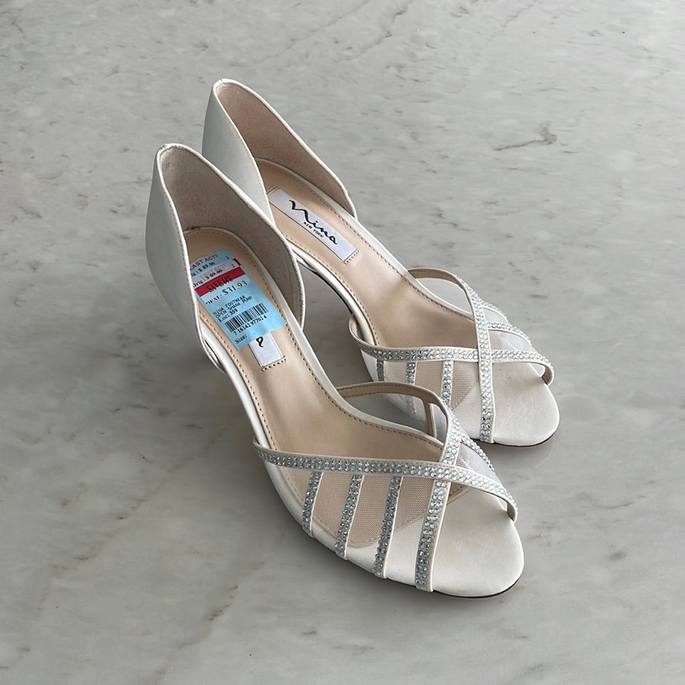 White heals with diamonds on the straps